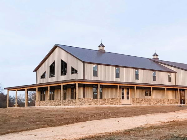 Blue Steel Manufacturing post frame shop home with stone wainscot